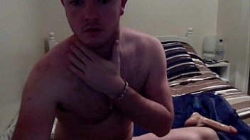 Hairy dude playing with a fake penis